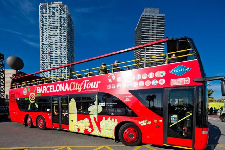 An open-top tour bus parked in Barcelona.