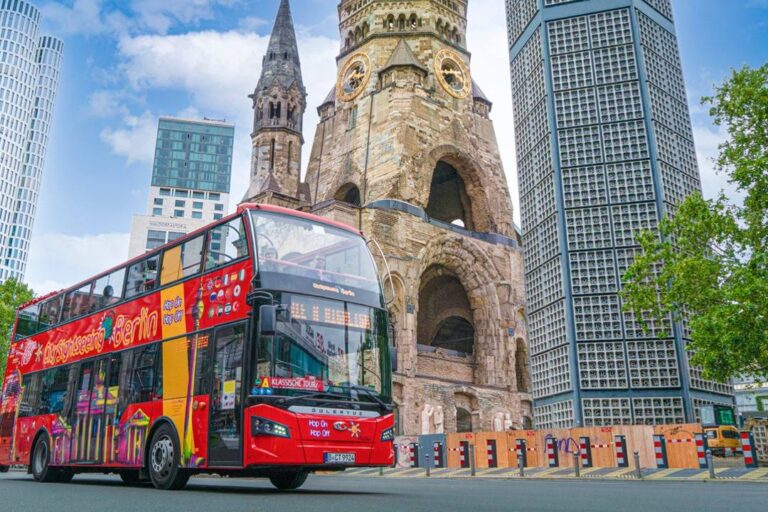 A Berlin bus tour driving past the Kaiser Wilhelm Memorial Church.