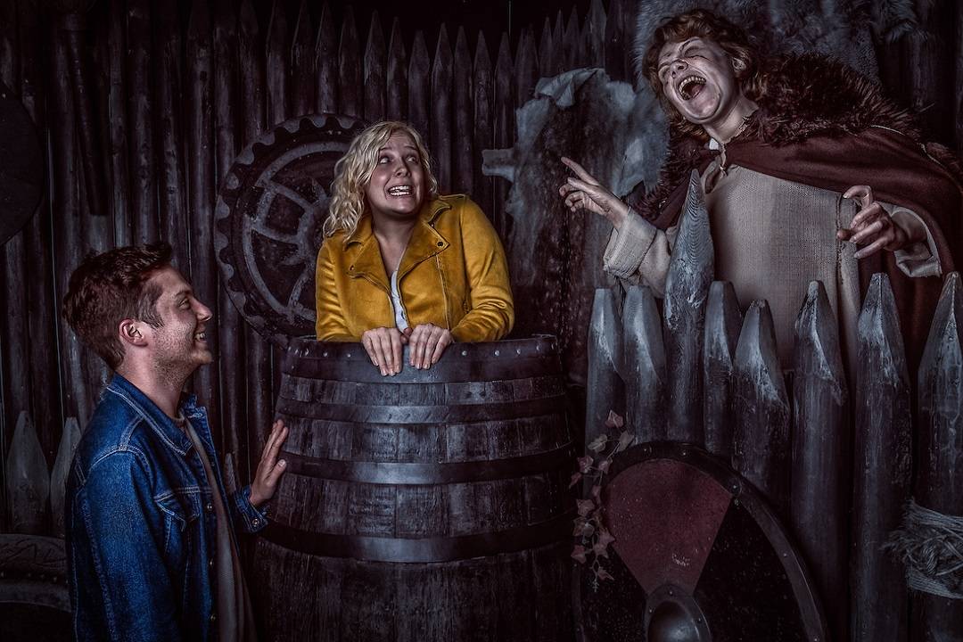 A viking standing behind a barricade that can be seen with York Dungeon Tickets.