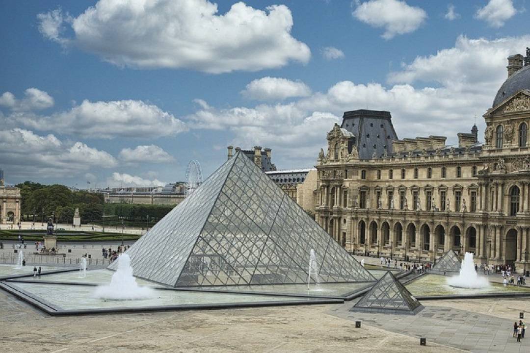 A photo of the Louvre in Paris, which you can access with Louvre Tickets.