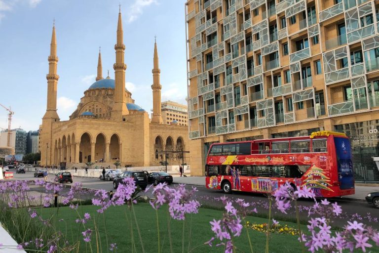 A photo showing a Beirut bus tour driving past the Mohammad Al Amin Mosque.