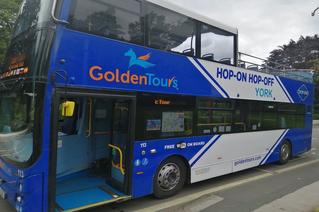 A photo of a hop-on hop-off York bus.