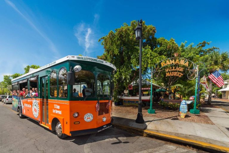 An old town trolley tour parked in Key West.