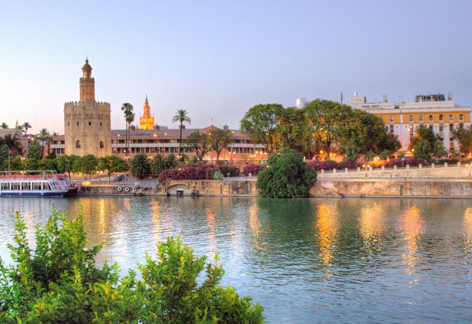 A photo of the Torre del Oro near the Guadalquivir river.