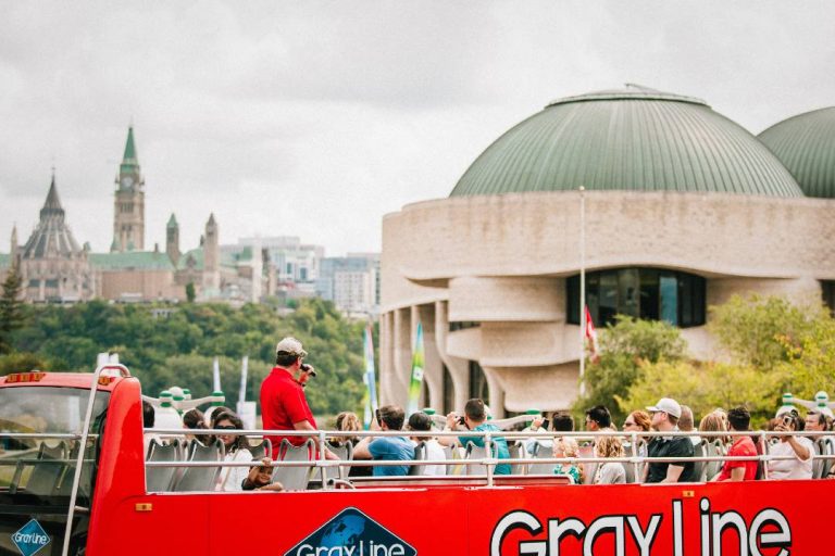 A photo of an Ottawa bus tour near the Canadian Museum of History.